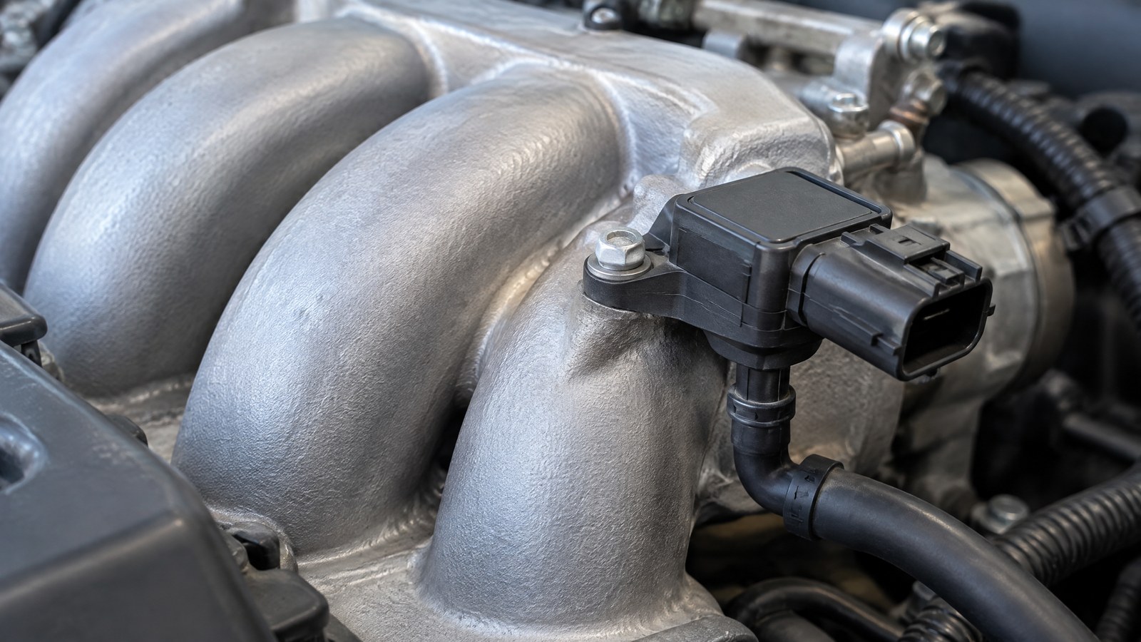 AI-generated generic illustration of an intake manifold and MAP sensor context, not a tested product.